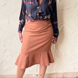 Brown tweed like midi skirt with peplum detail!